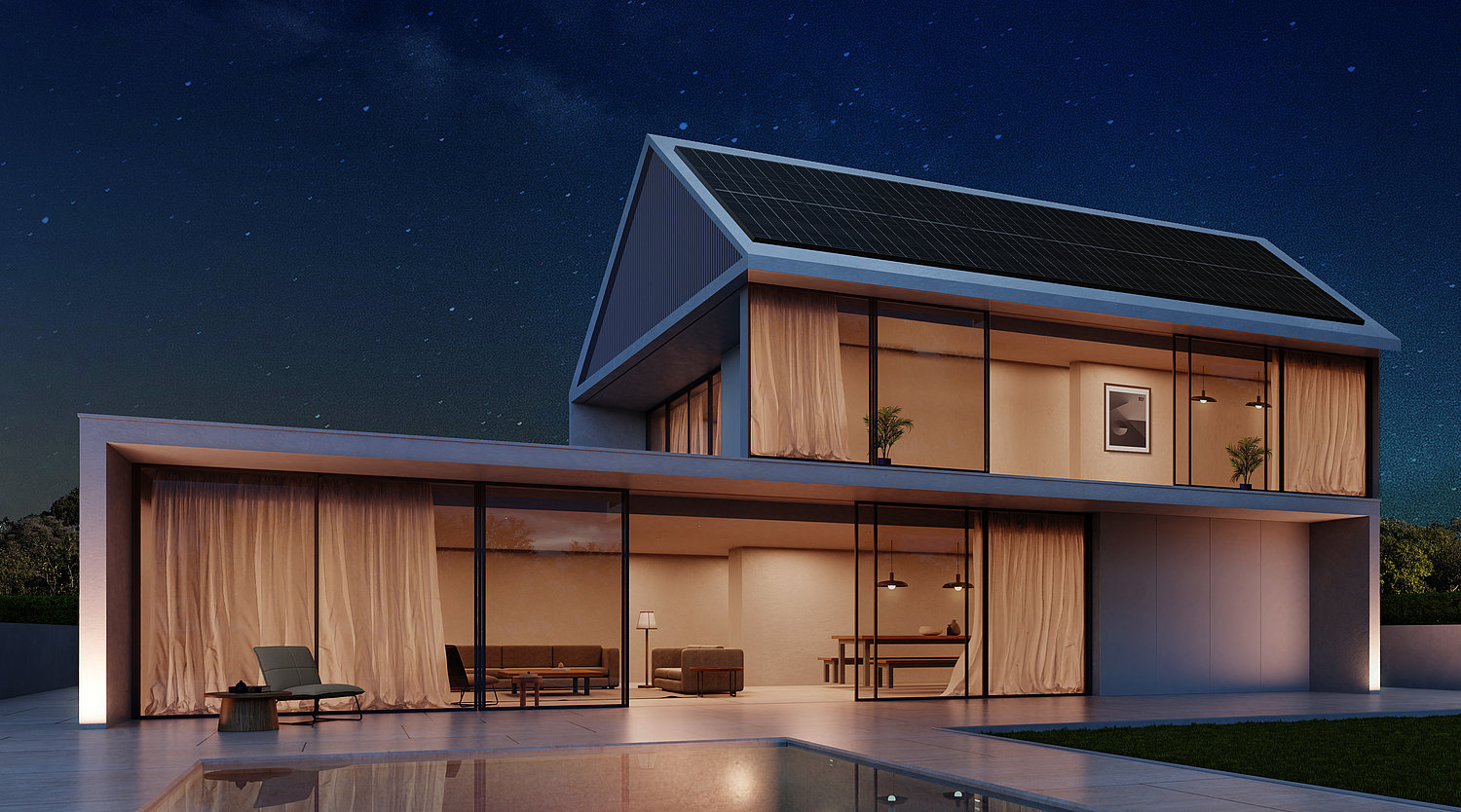 Bild zeigt ein Haus bei Nacht, das hell erleuchtet ist, dank gespeichertem Solarstrom